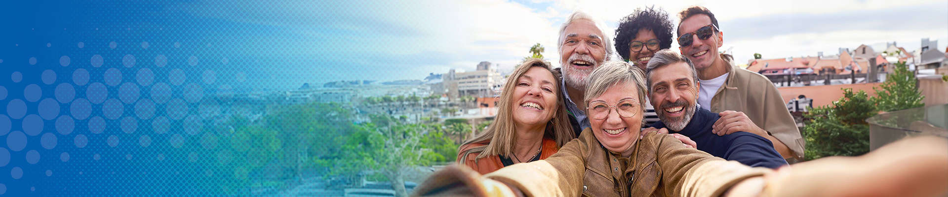 Group of people taking a selfie outdoors