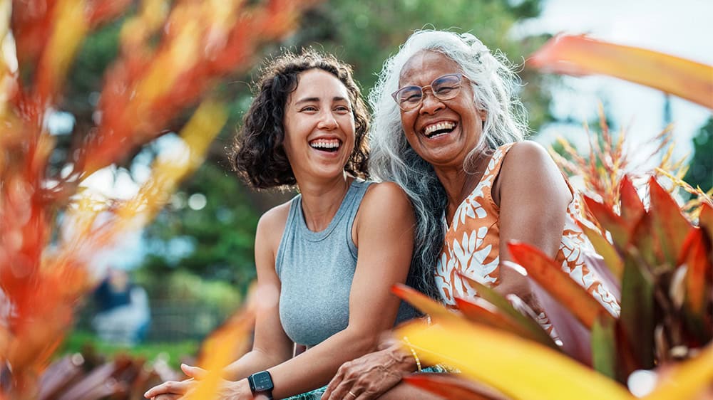 Two women laughing together