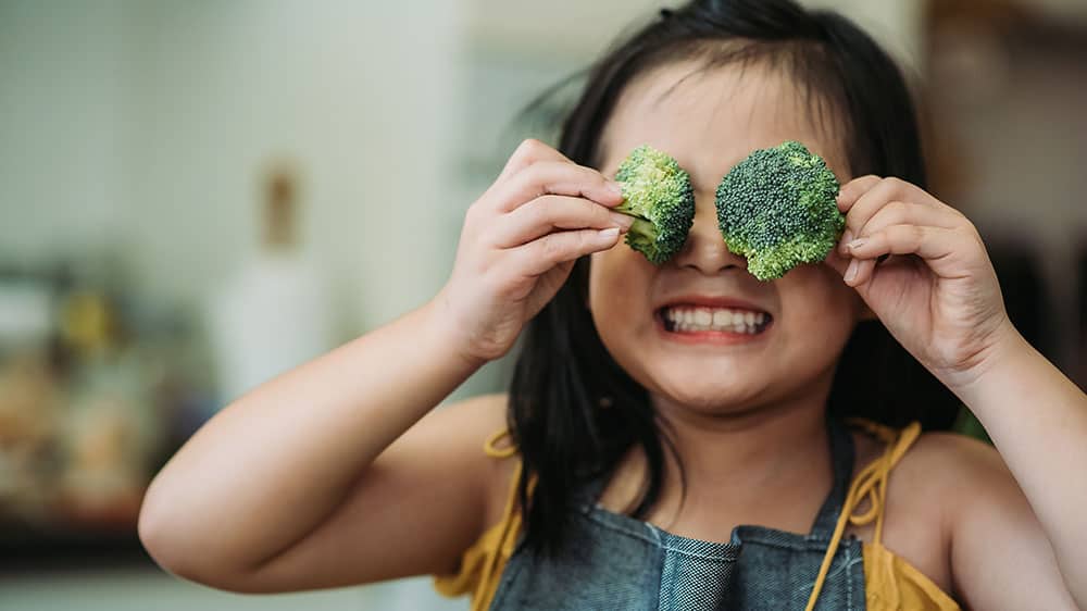 Child having fun in the kitchen