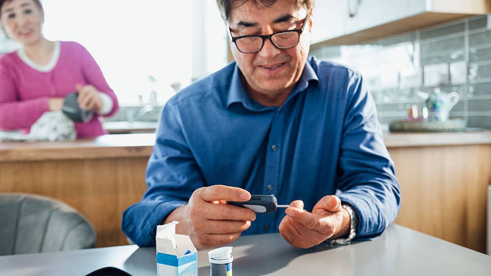 Man checking his blood glucose